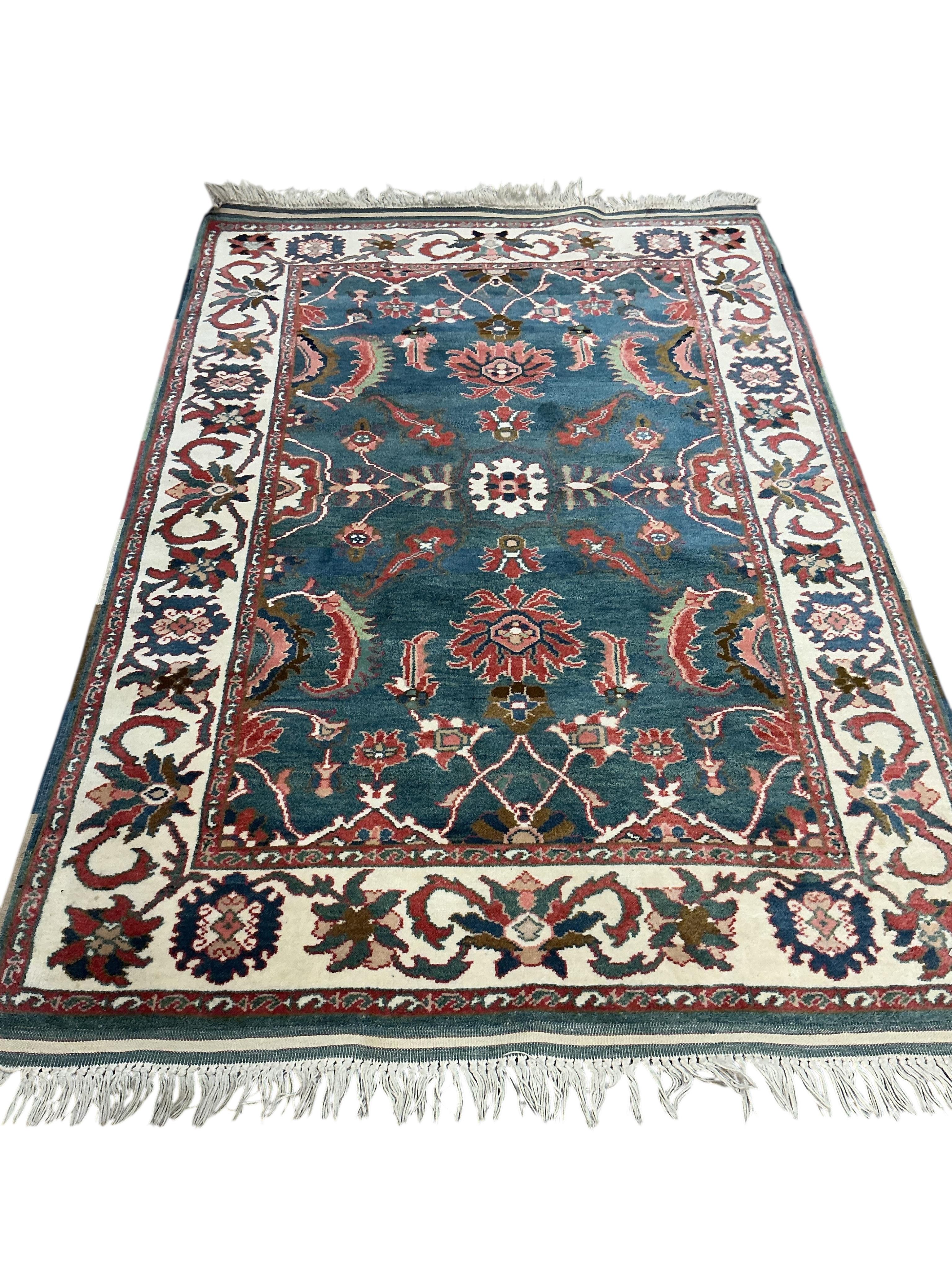 A Tabriz blue ground rug, 204 x 134cm.